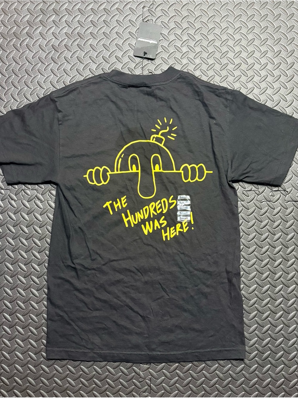 The Hundreds Black Tee with Yellow Peeking Character Back Graphic